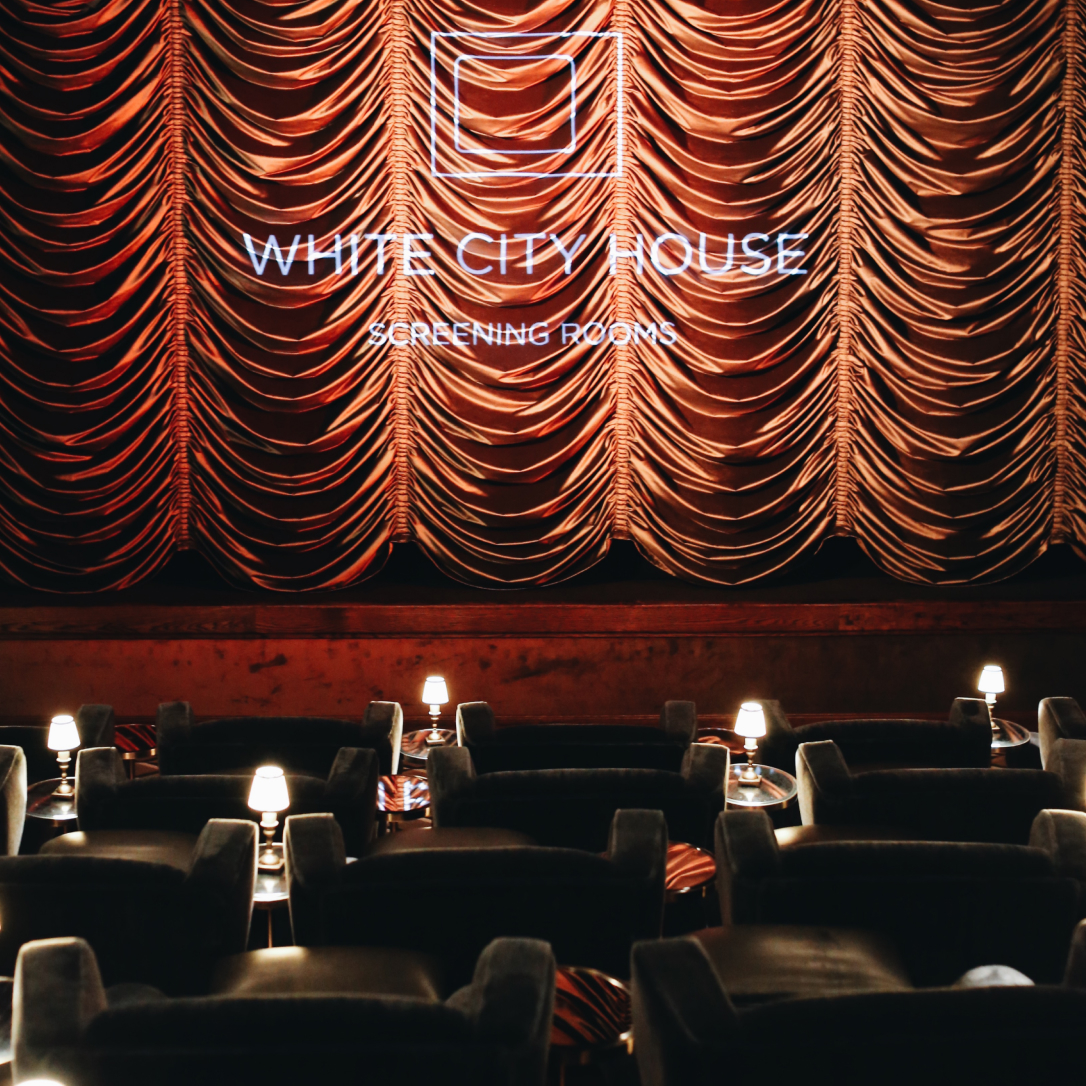 A red curtain down on a cinema screen.