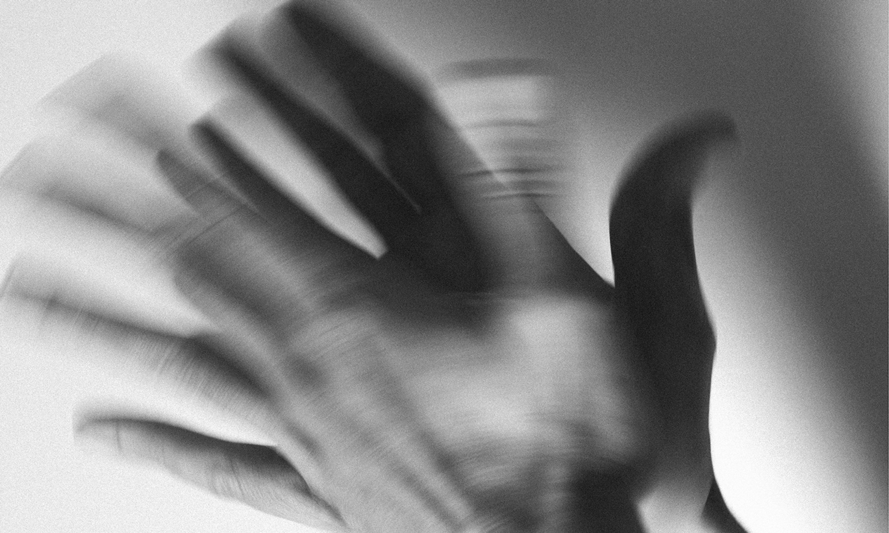 Black and white hands gesticulating.