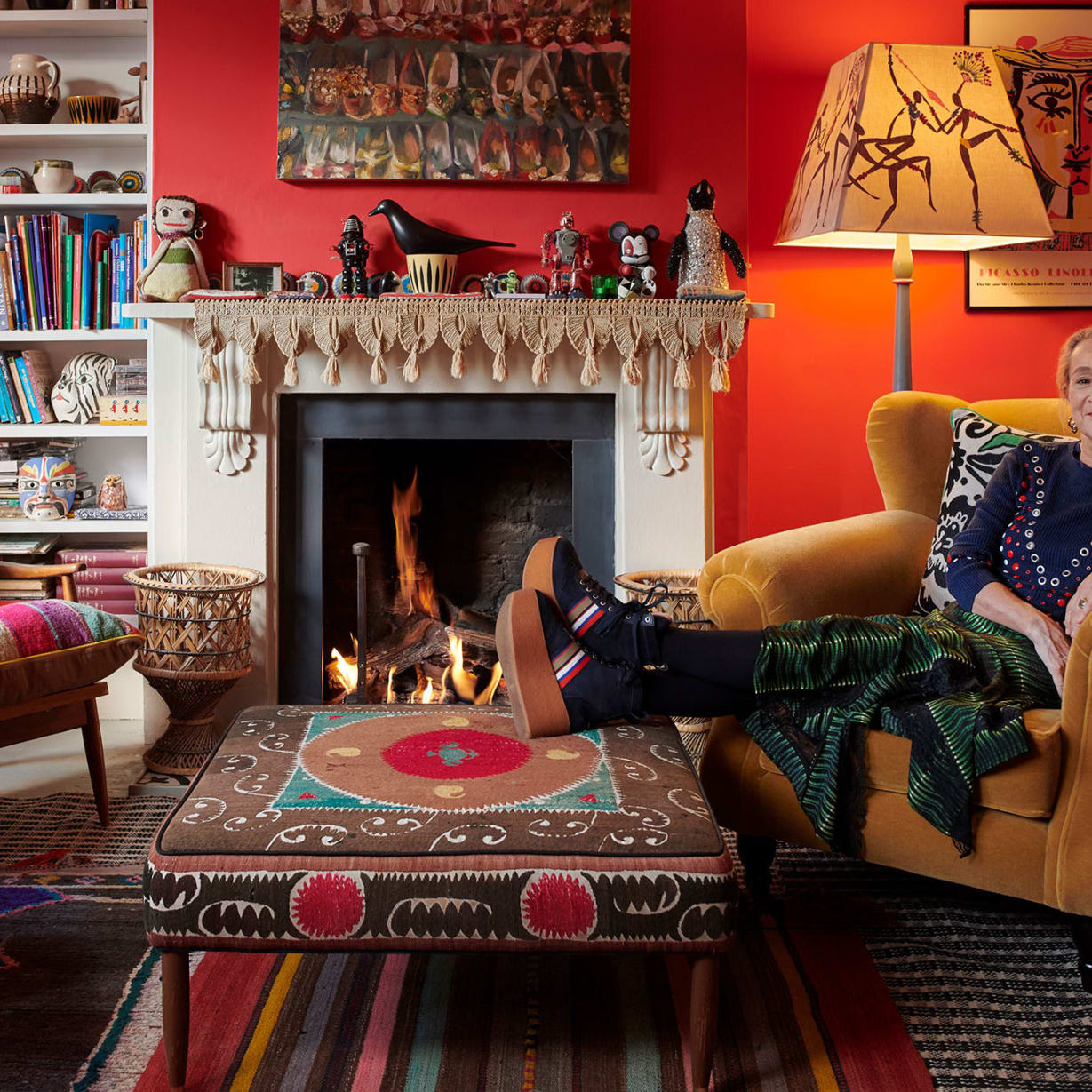 Woman lying relaxed in armchair in colourful living room