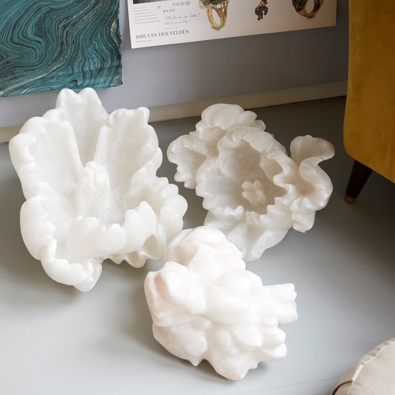 Three white flower sculptures.