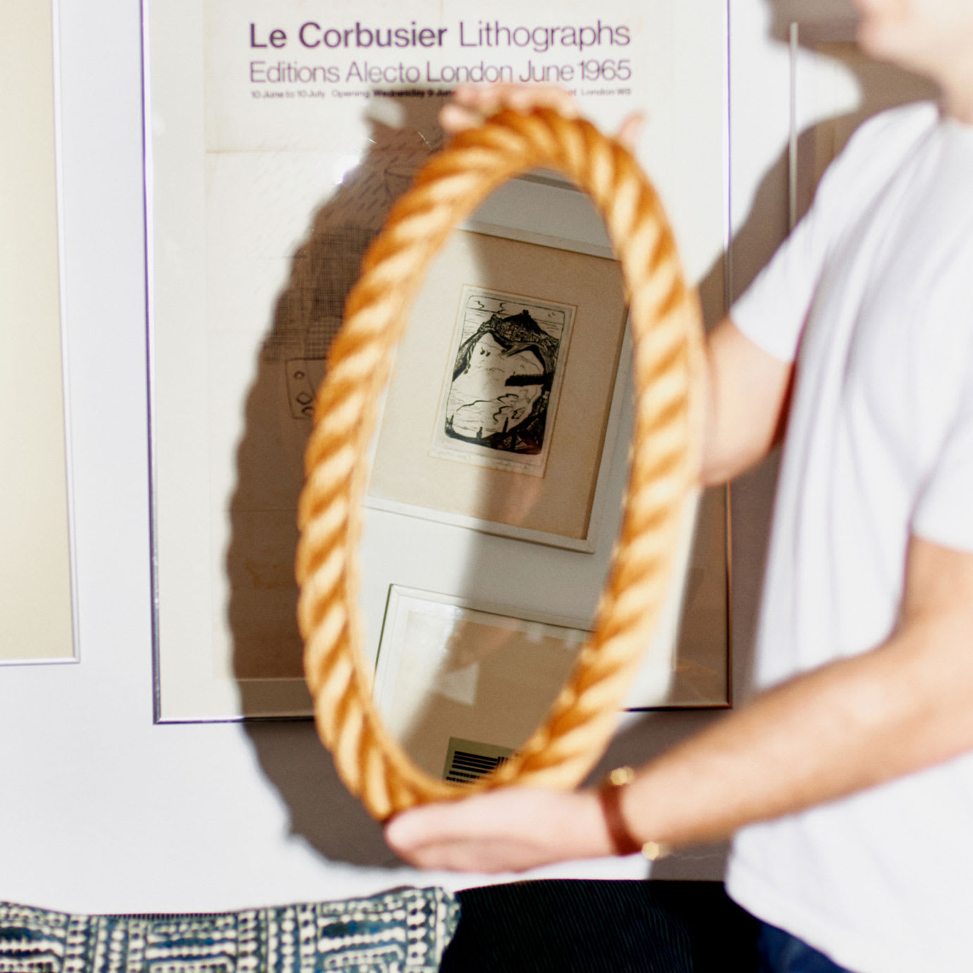 A man holding a mirror.