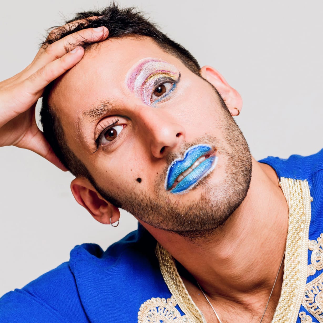 A man wearing blue lipstick.