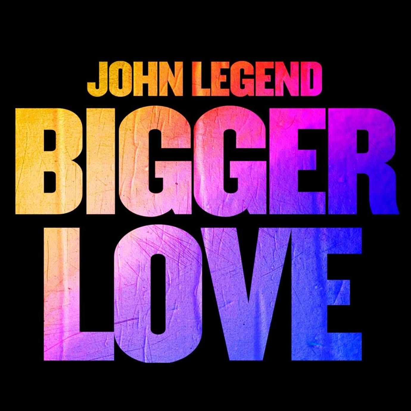 An album cover with John Legend Bigger Love written on it in colourful type.