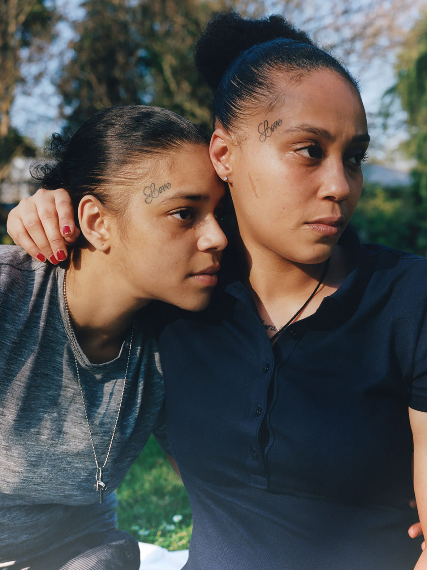 Two girls hugging.
