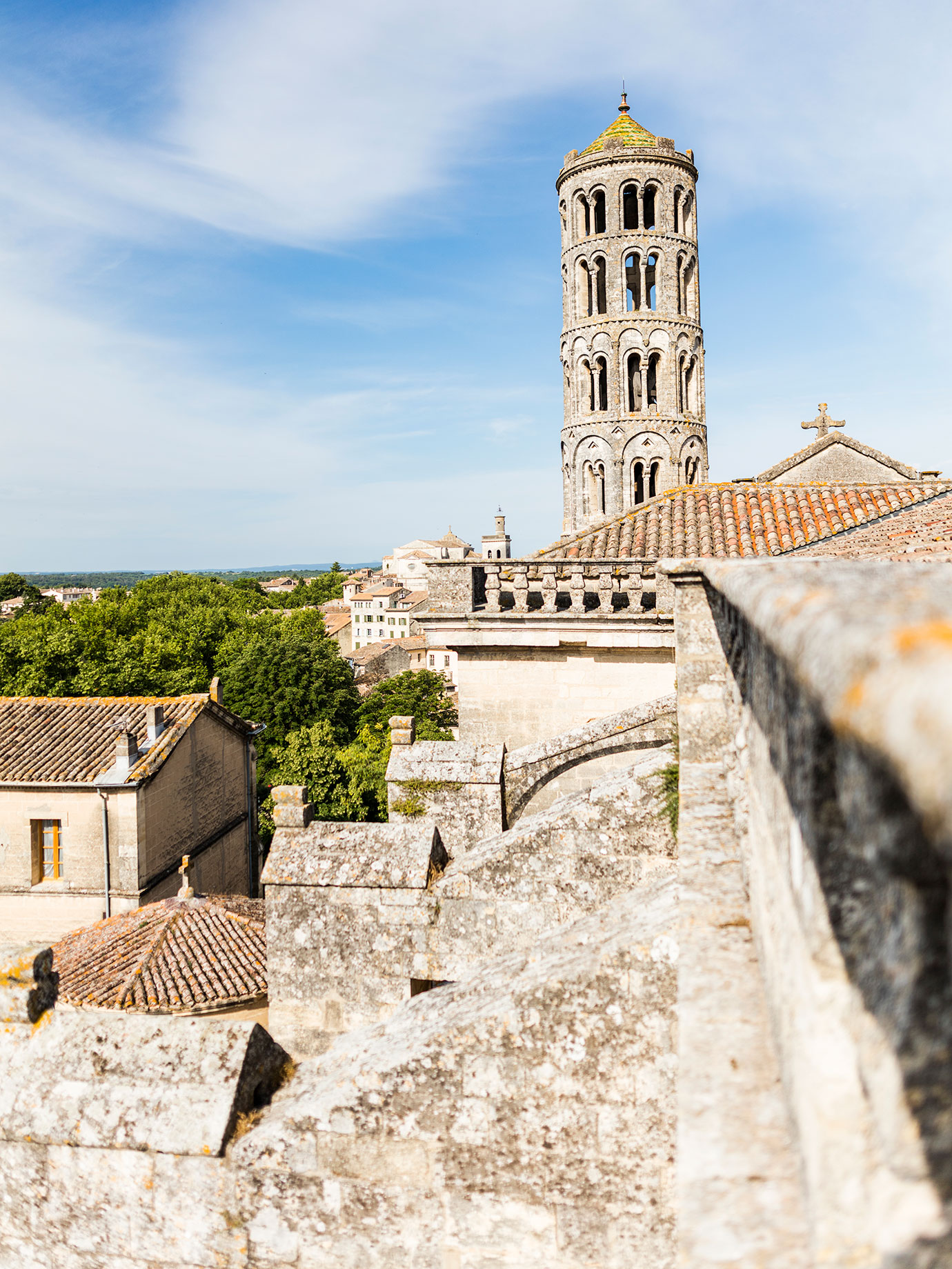 A french village with a historic tall tower.