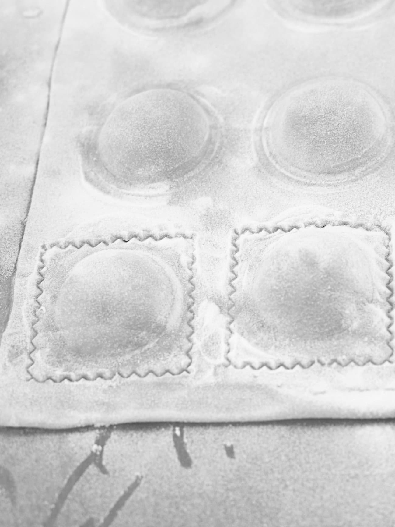 Ravioli being made and about to be cut.