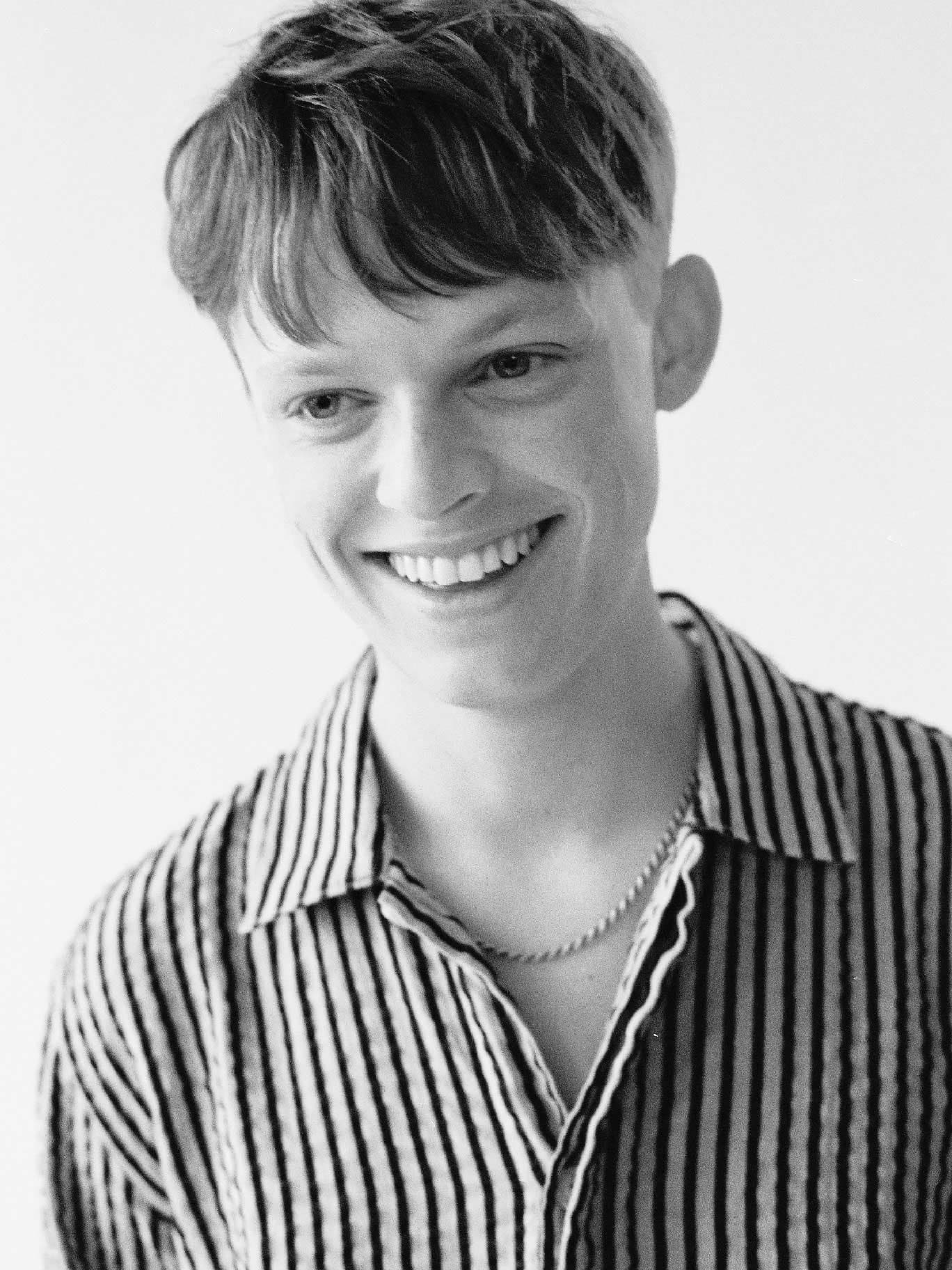 black and white photo of smiling man
