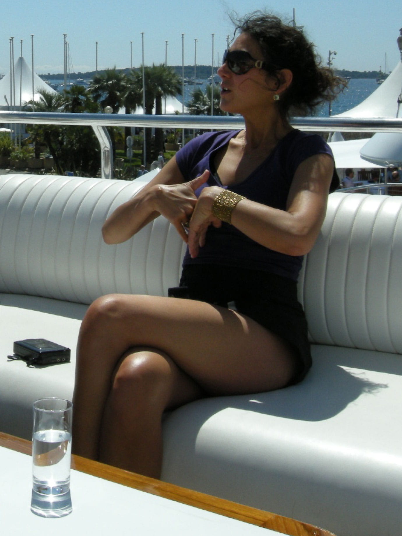 A woman sitting on a boat's deck.