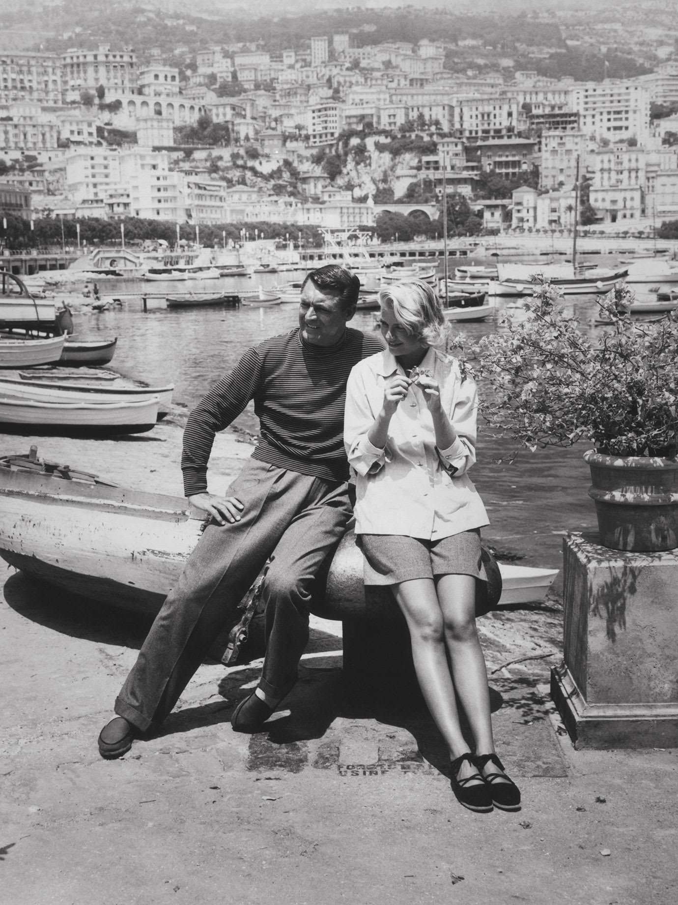 A vintage photograph of a man and a woman overlooking the french riviera.