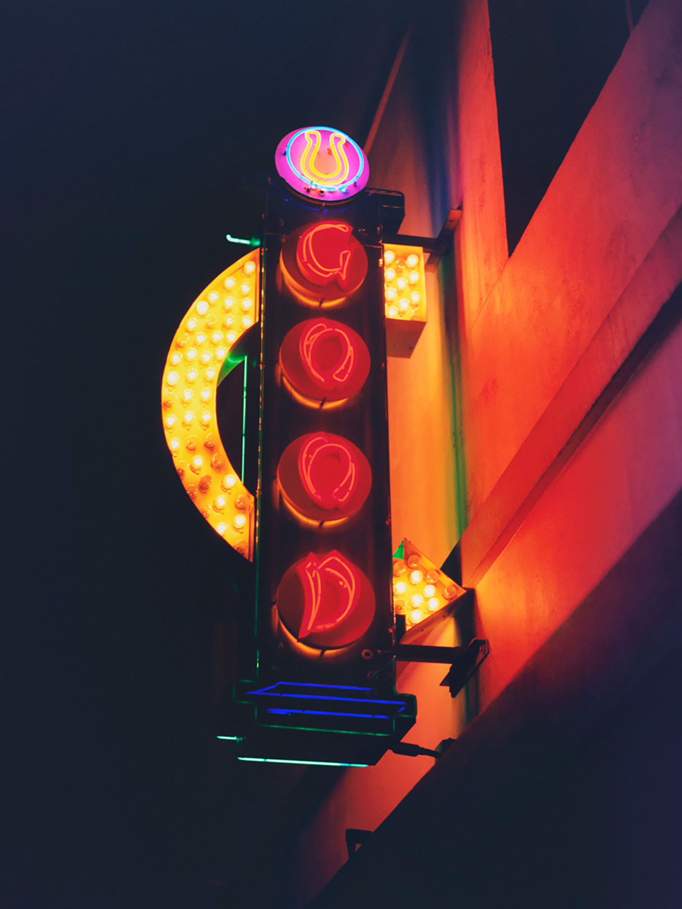 A neon sign with Good written on it.