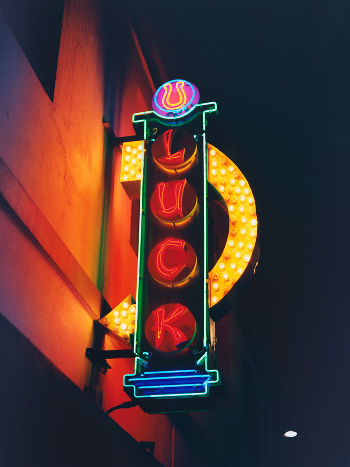 A neon sign with Luck written on it.
