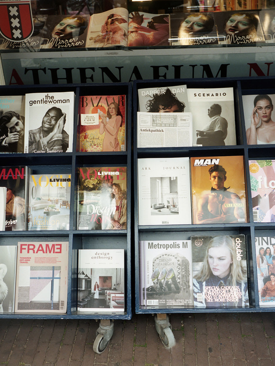 Magazines on an outdoor rack.
