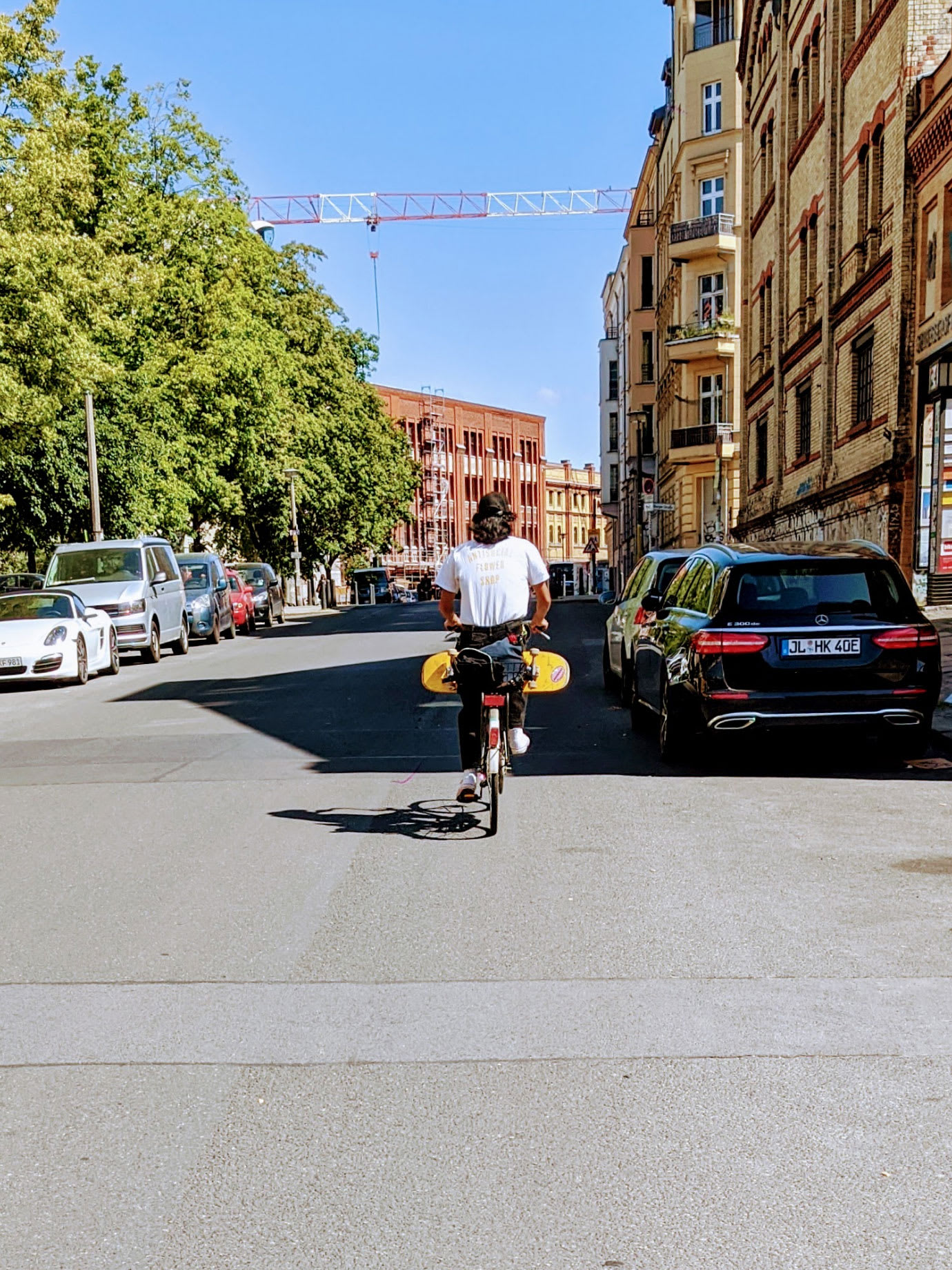 A man cycling down a city street.