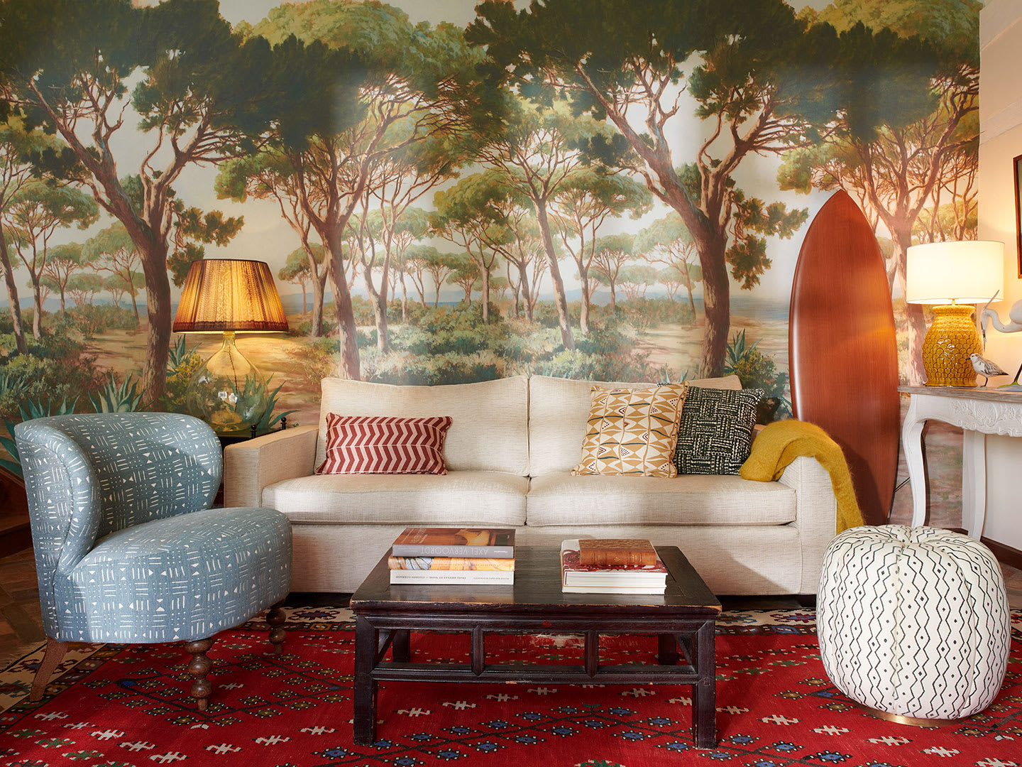 A lounge interior with forest wallpaper.