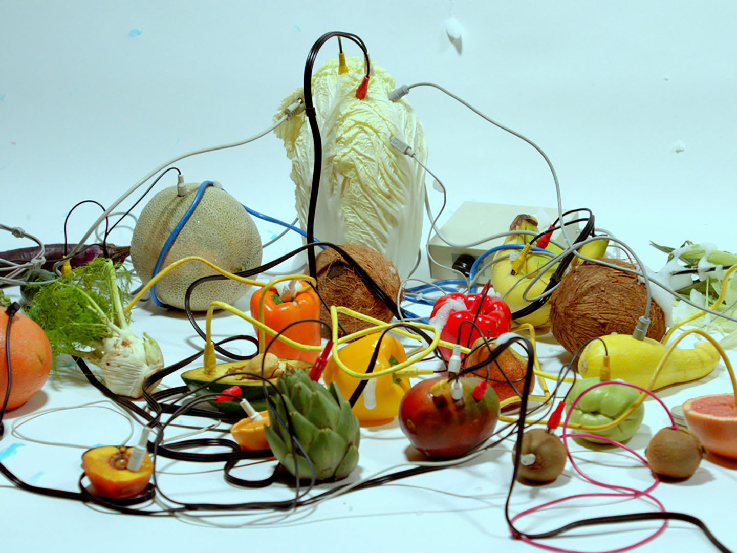 Various fruit items connected by wires.