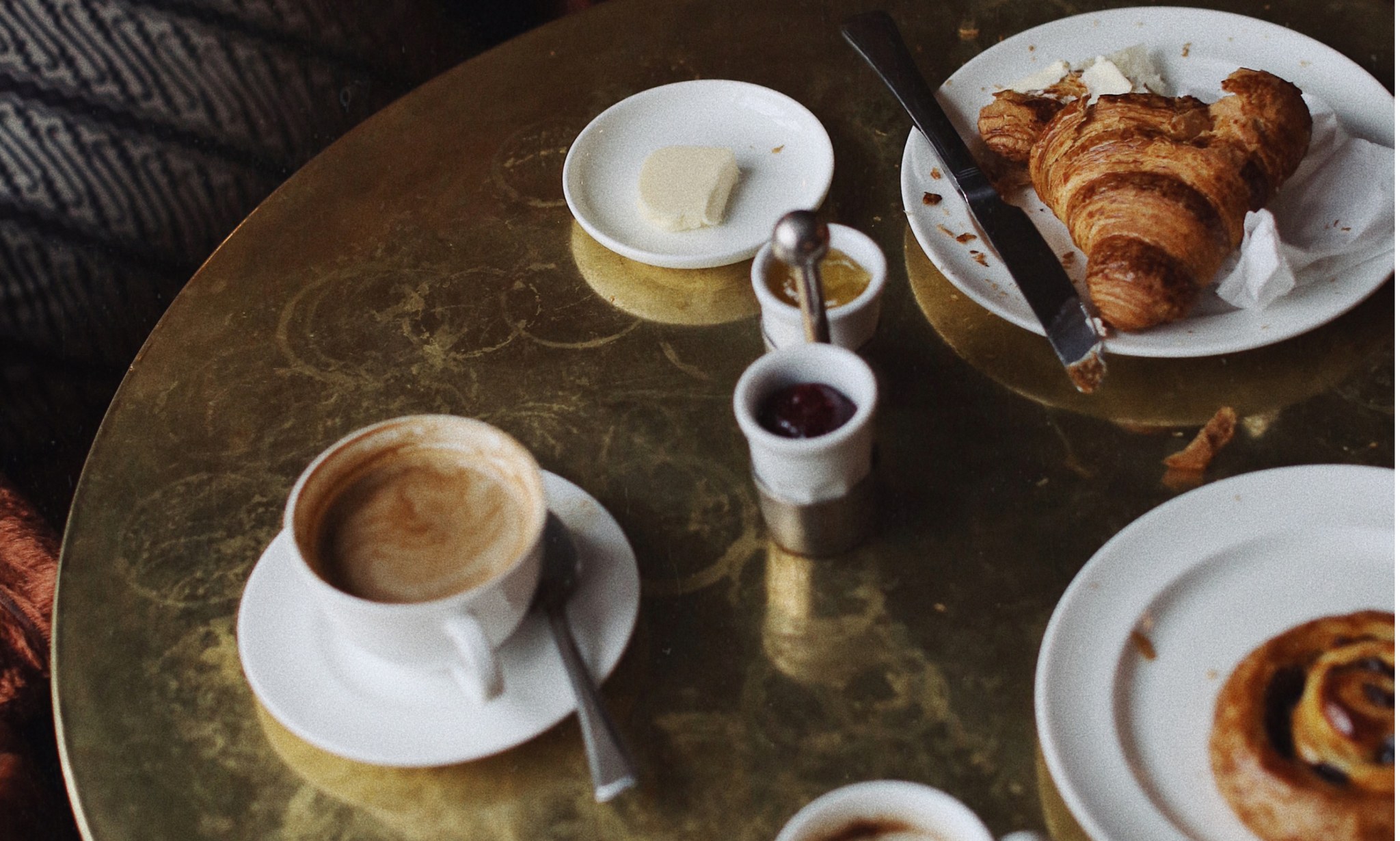 A half eaten breakfast on a table.