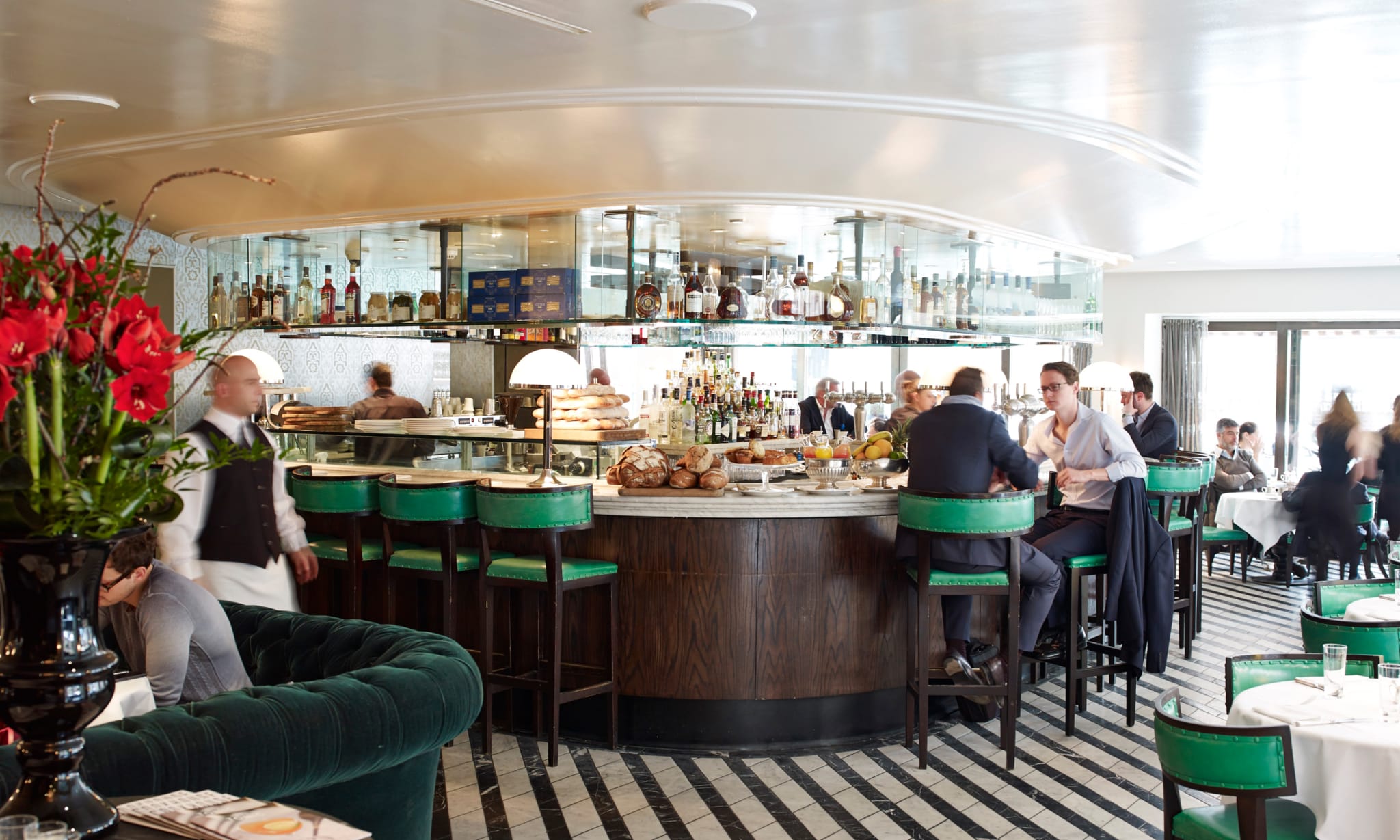 The interior of a restaurant with a central circular bar.