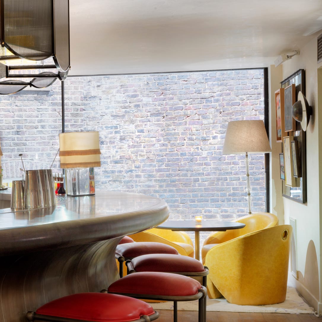 A curved bar with a sliding door behind it.