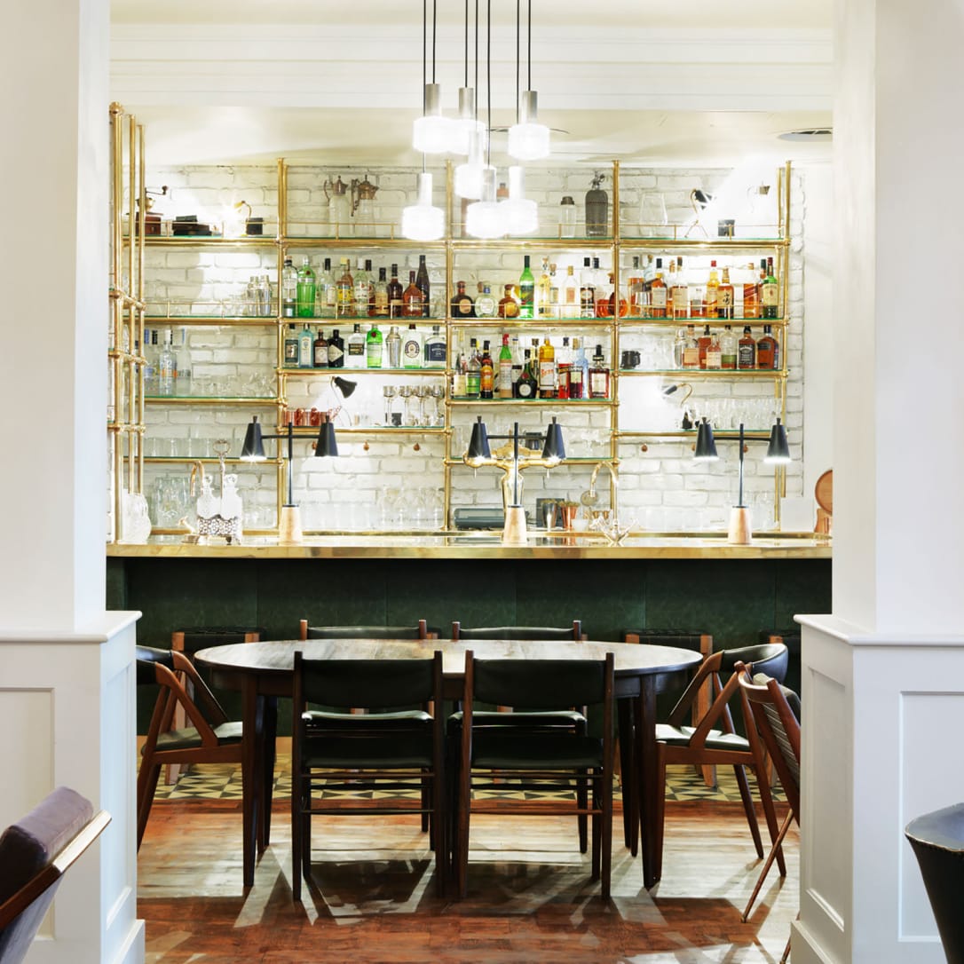A bar in a white room.