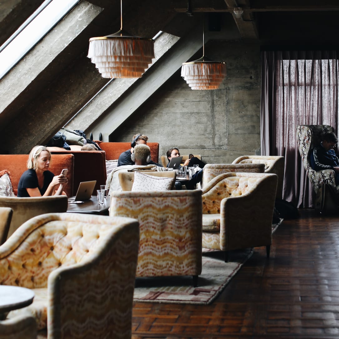 A relaxed lounge-like space with people sitting in it.