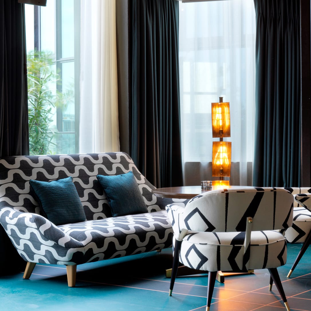 A lounge like room with sofas and chairs.