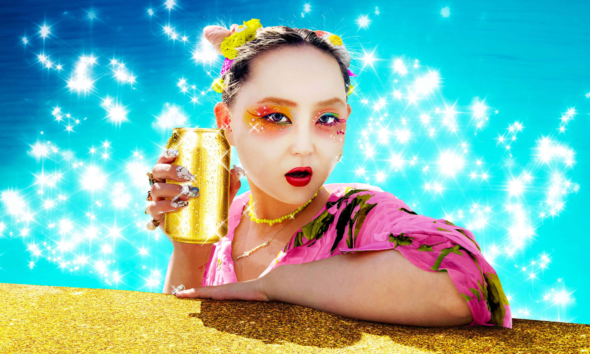 A girl in geisha make-up holding a golden drinks can.