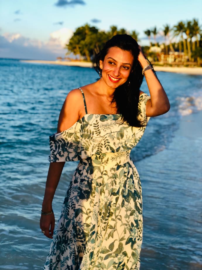 Divia Thani, a young Indian woman and editor of CN Traveller India, on the beach in Mauritius.
