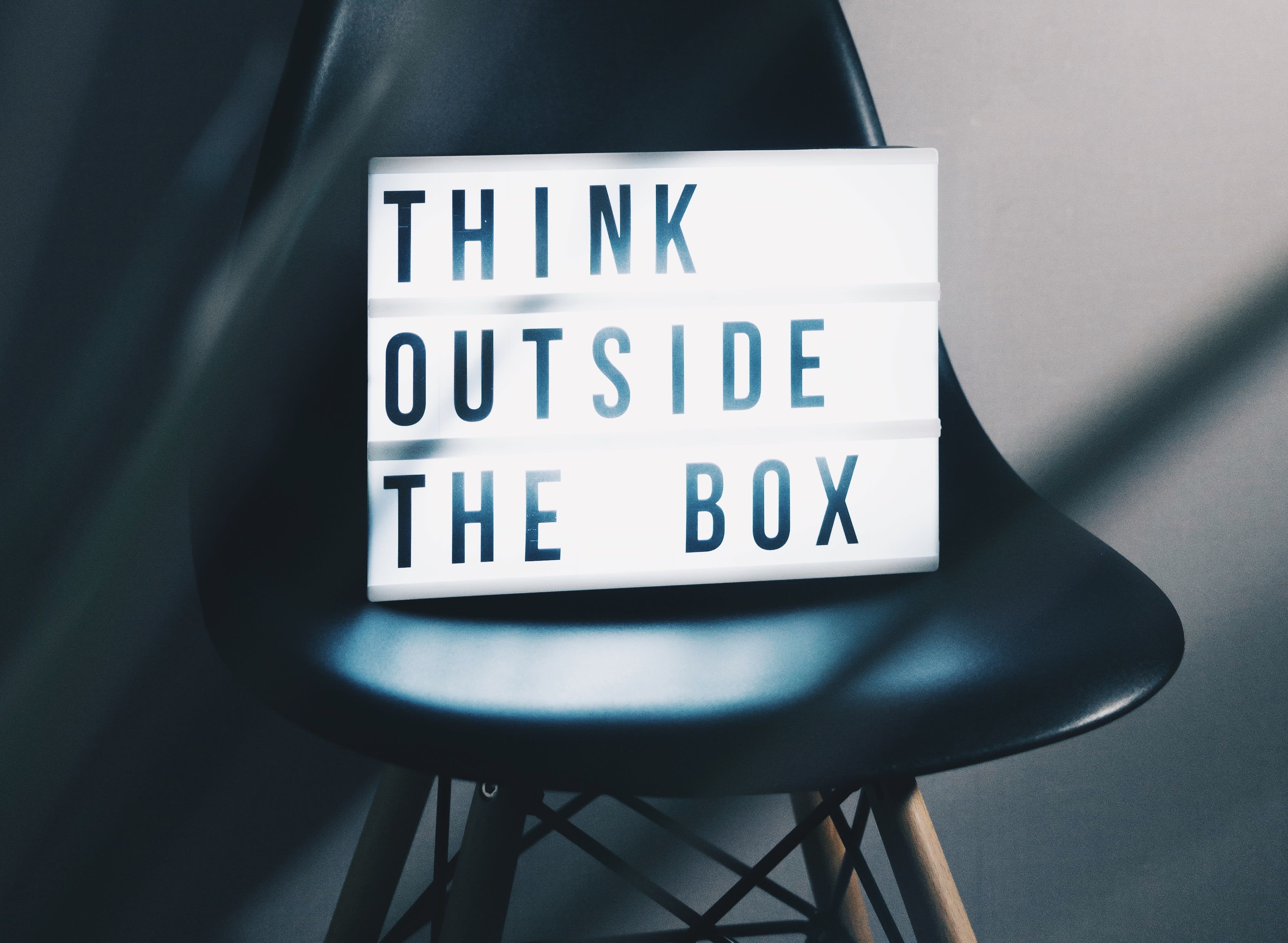 Light box quote: "Think outside the box."