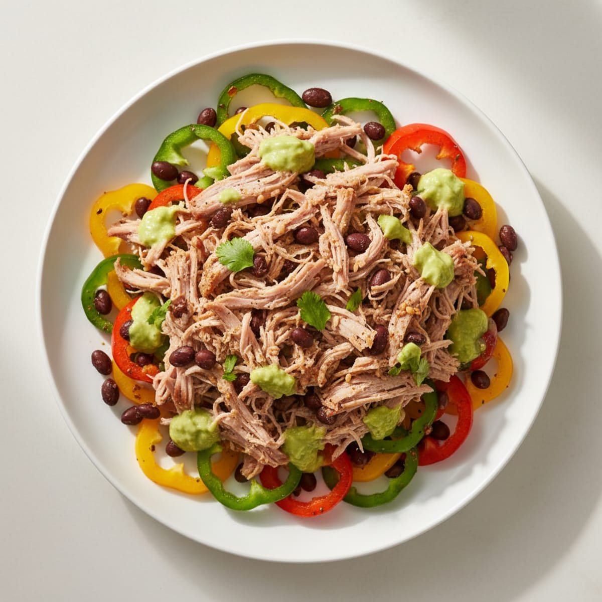 Pulled Pork Nachos with Avocado Crema