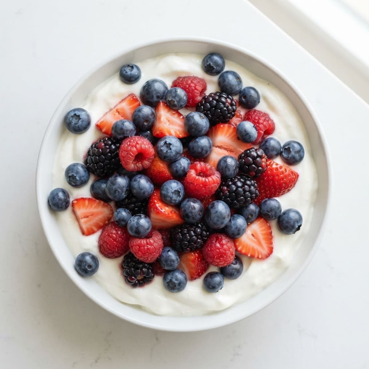 Silky Greek Yogurt Bowl with Mixed Berries and Protein Powder