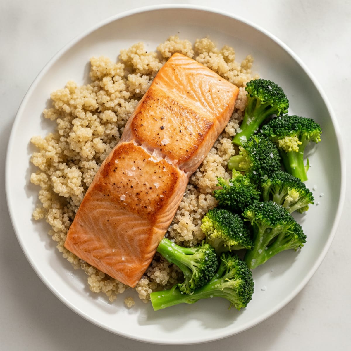 Seared Salmon Fillet with Steamed Broccoli and Quinoa