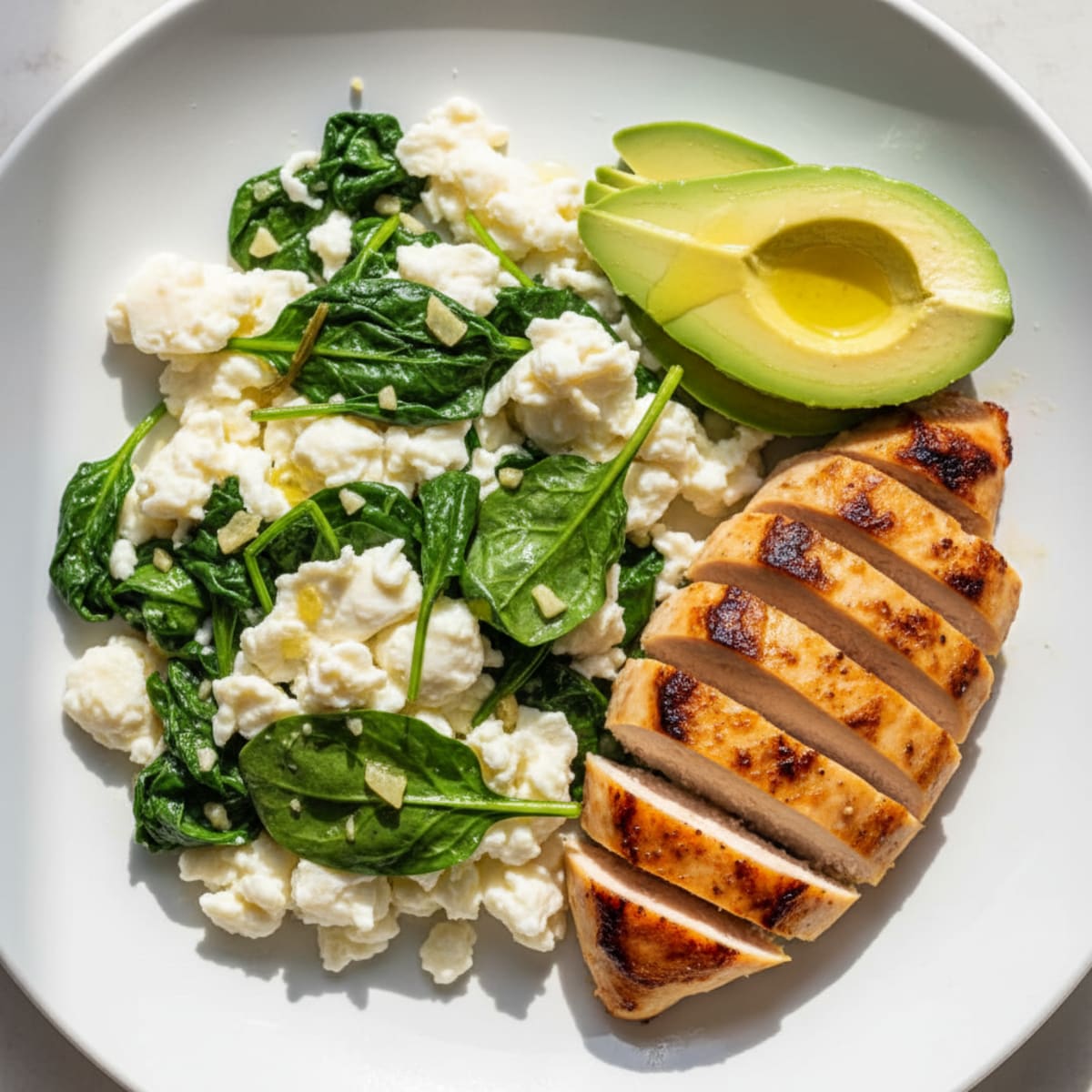 Scrambled Egg Whites with Sautéed Spinach and Grilled Chicken Breast