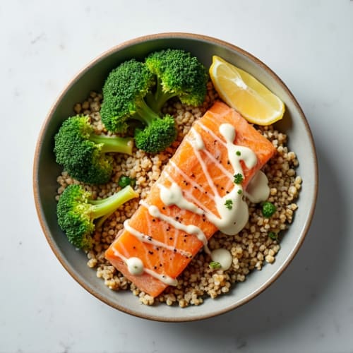 Salmon Quinoa Bowl with Roasted Broccoli and Lemon Tahini Drizzle