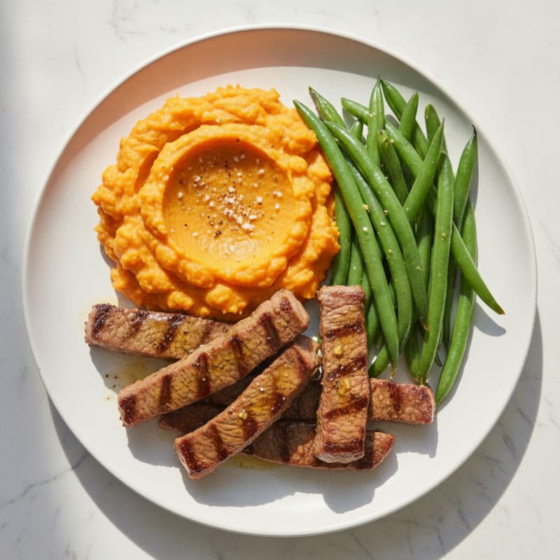 Seared Beef Strips with Steamed Green Beans and Sweet Potato Mash