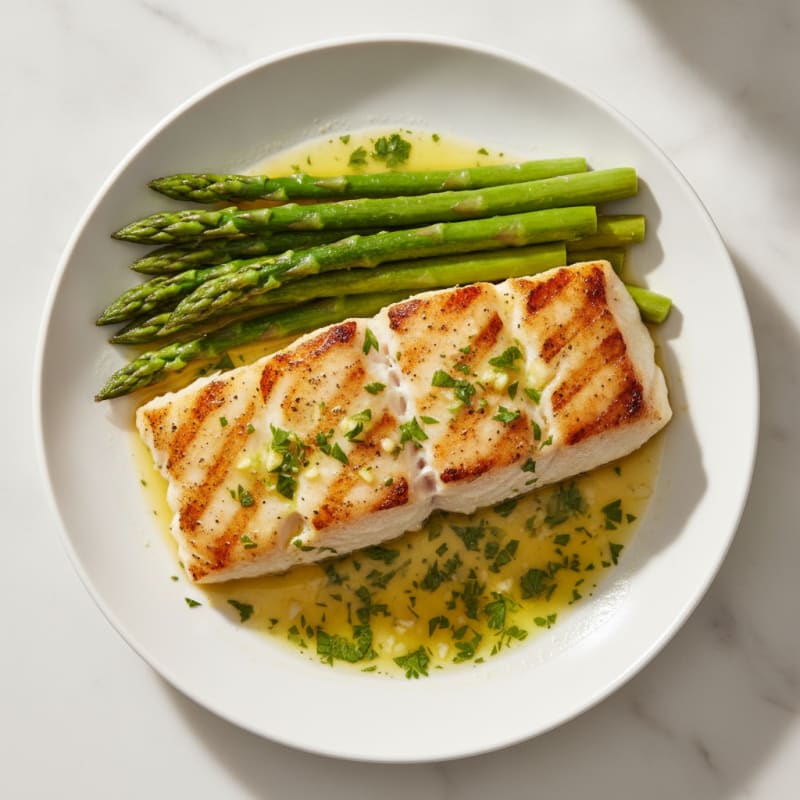 Grilled Cod with Steamed Asparagus and Lemon Herb Sauce