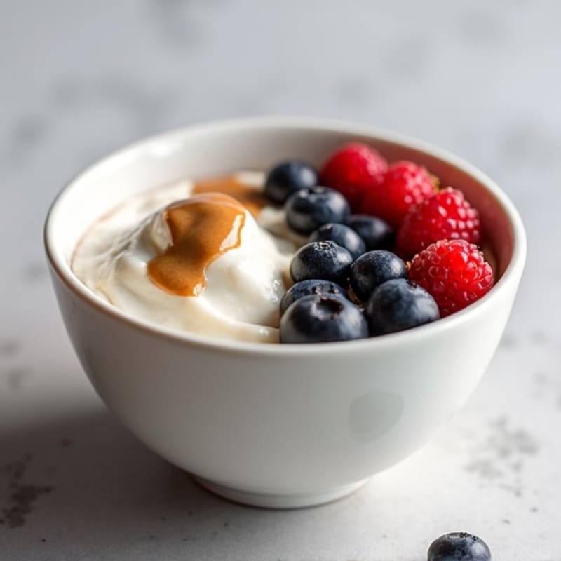 Silky Protein Yogurt Bowl with Mixed Berries and Almond Butter