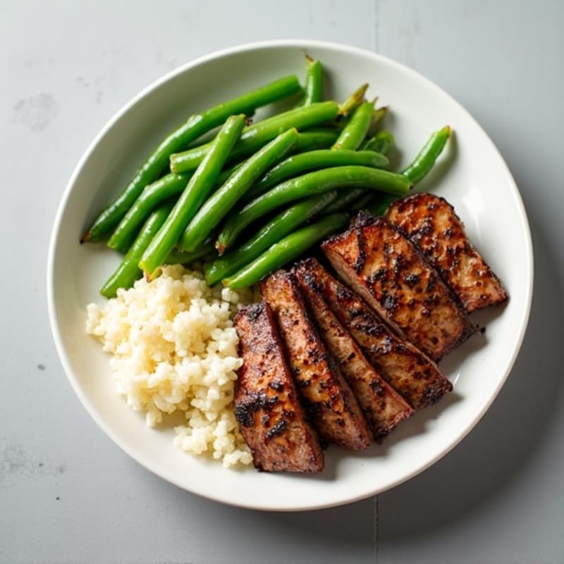 Seared Lean Beef Strips with Garlic Green Beans and Cauliflower Rice