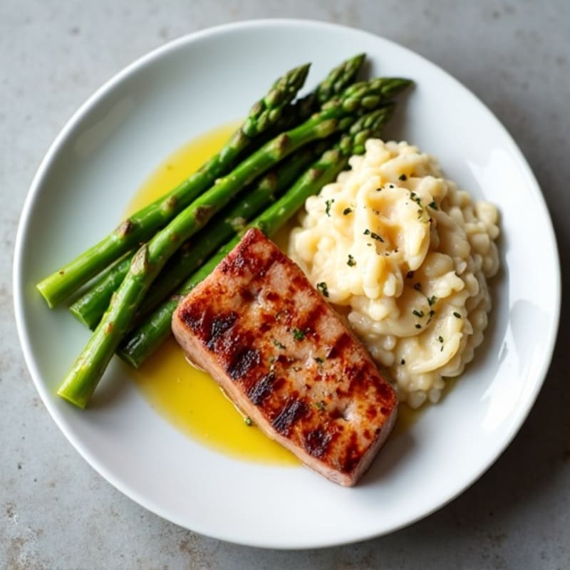 Seared Tuna Steak with Steamed Asparagus and Garlic Mashed White Beans