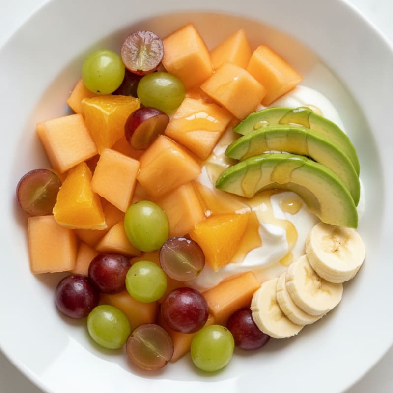 Protein Yogurt Bowl with Grapes, Melon, and Orange Segments