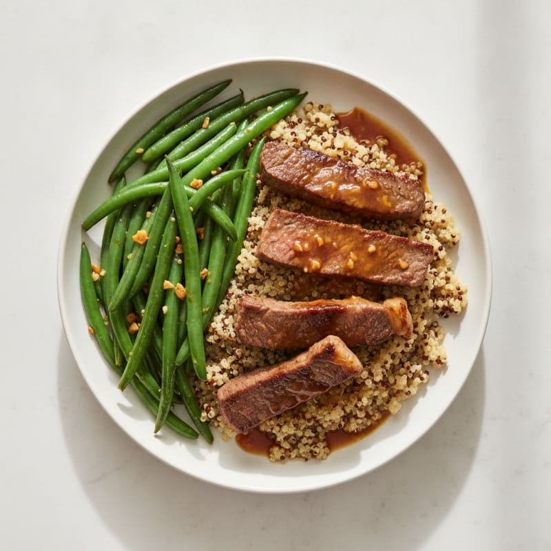 Seared Lean Beef Strips with Garlic Green Beans and Quinoa