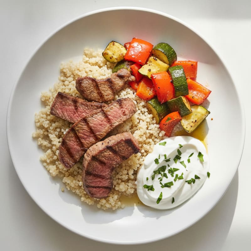 Seared Beef Strips with Roasted Vegetables and Quinoa