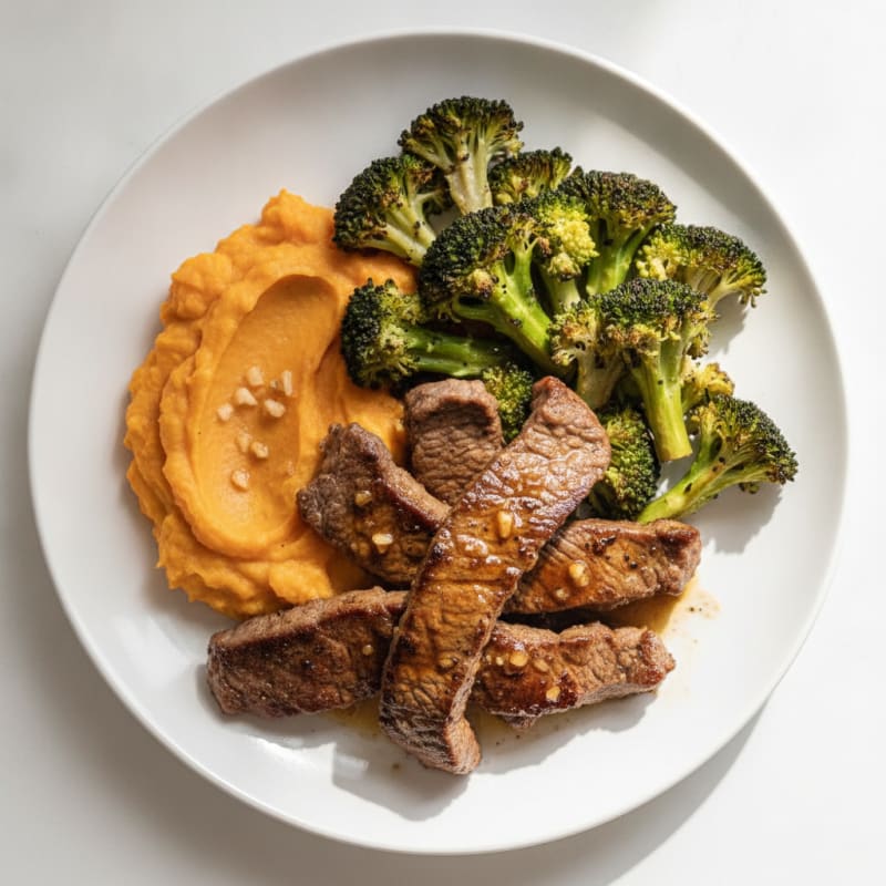 Seared Lean Beef Strips with Roasted Broccoli and Sweet Potato Mash