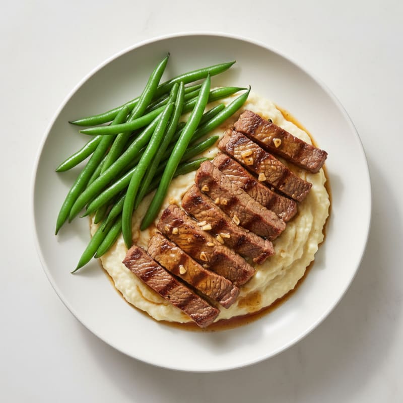 Seared Lean Beef Strips with Steamed Green Beans and Cauliflower Mash