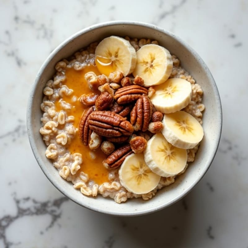 Protein Oatmeal with Caramelized Banana and Toasted Pecans