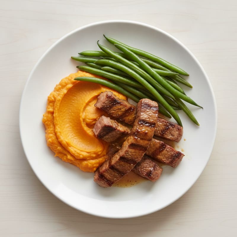 Seared Lean Beef Strips with Steamed Green Beans and Sweet Potato Mash