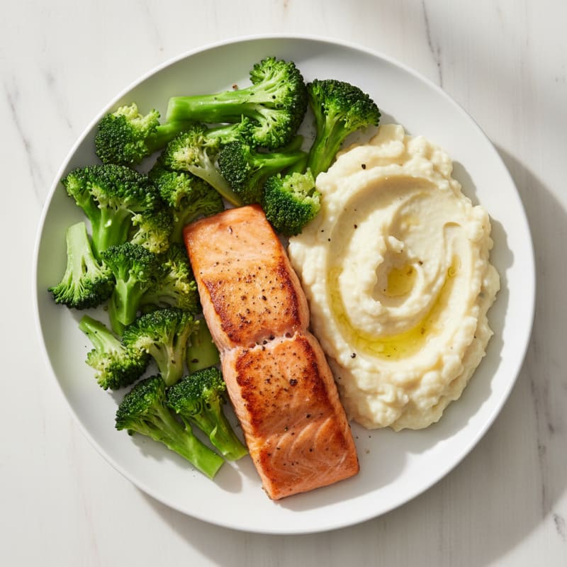 Seared Salmon Fillet with Steamed Broccoli and Creamy Garlic Mashed Cauliflower