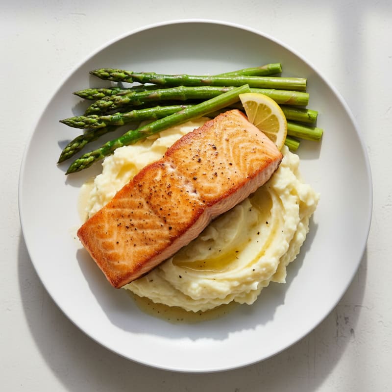 Pan-Seared Salmon with Creamy Garlic Mashed Potatoes and Steamed Asparagus