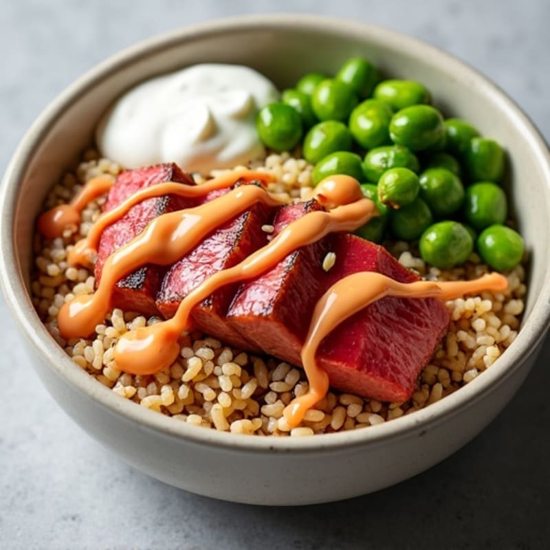 Seared Ahi Tuna and Crispy Edamame Rice Bowl with Creamy Sriracha Drizzle