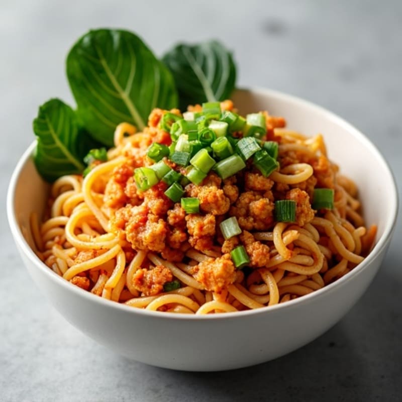 Spicy Sesame Ground Chicken Noodle Bowl with Crispy Bok Choy