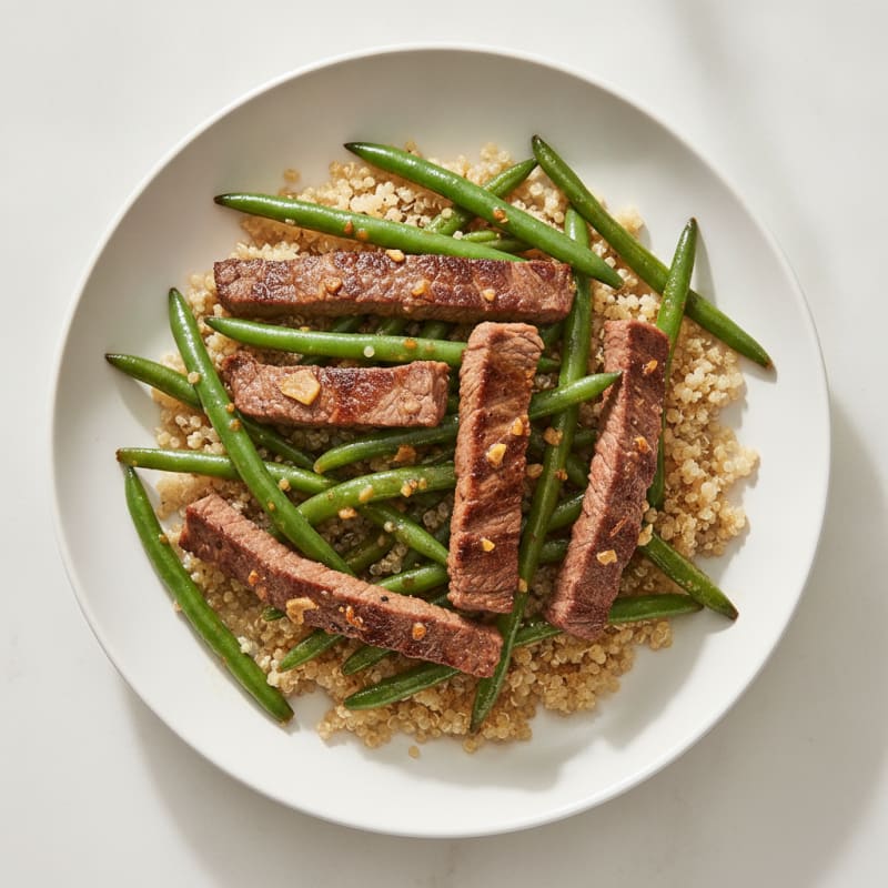 Seared Beef Strips with Garlic Green Beans and Quinoa